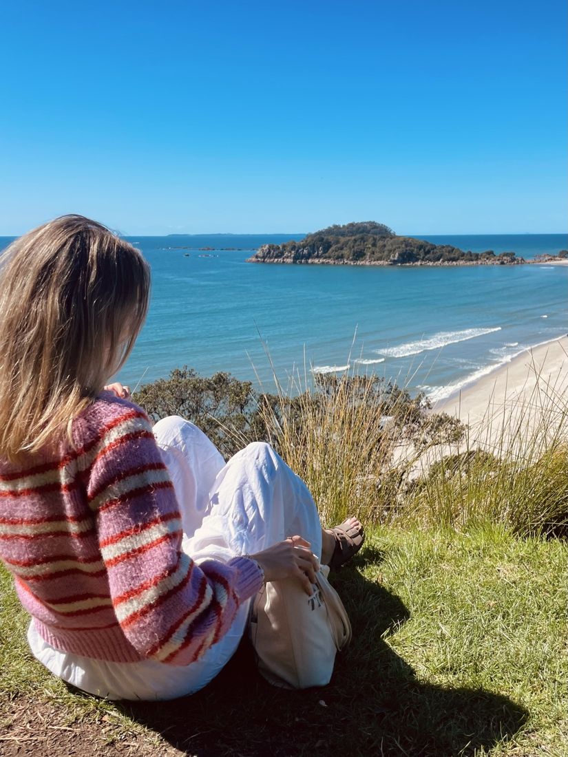 Emma at the summit of Mount Maunganui looking over the sea